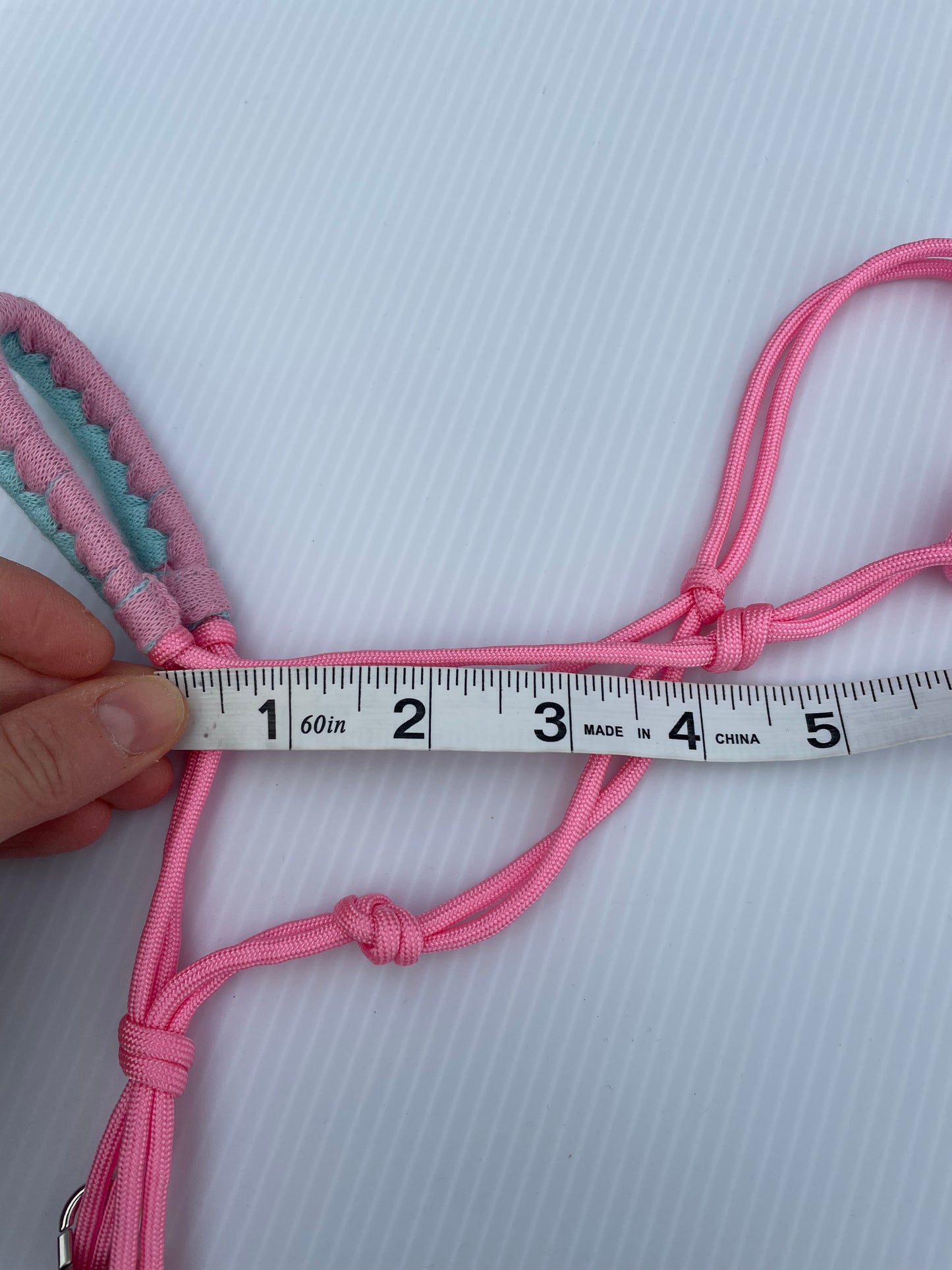 Hobby horse halter pink on a white background. Measuring the sides of the halter 4".