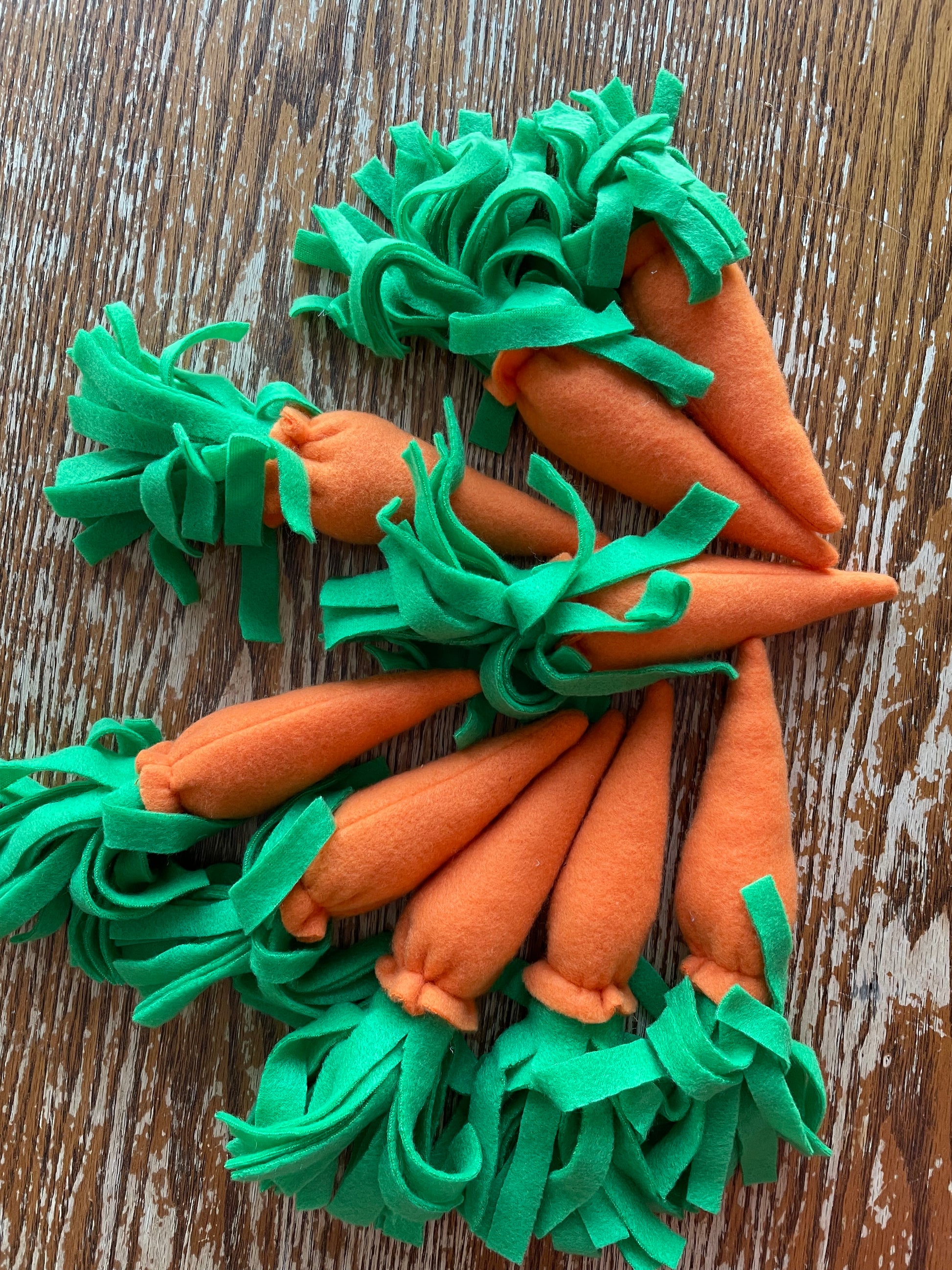 Hobby horse carrots on a wooden backround