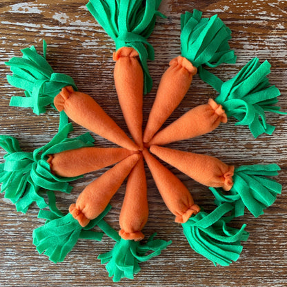 Hobby horse carrots on a wooden backround