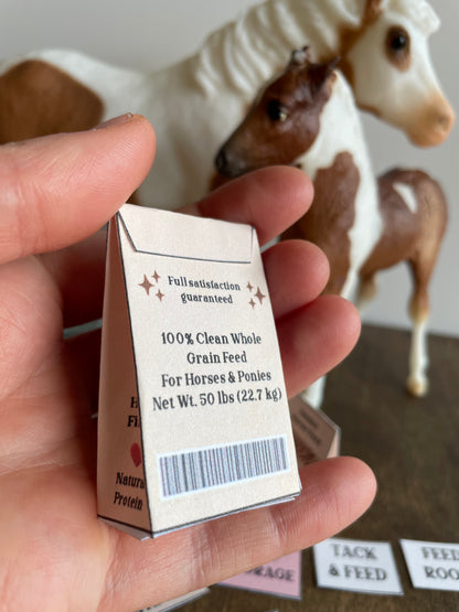 Hand holding a small horse feed bag with a horse figurine in the background