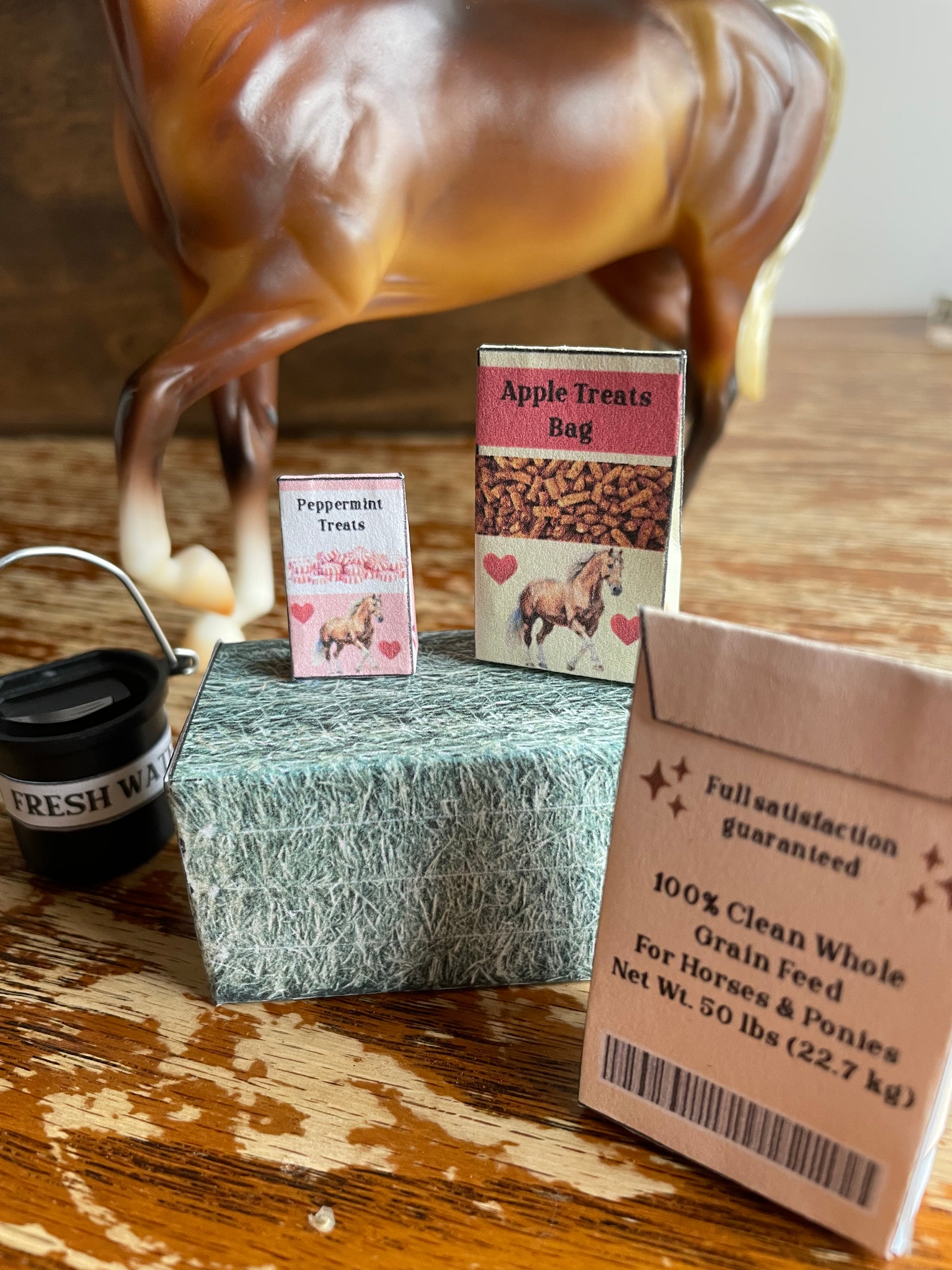 Close-up of minaiture horse feed items on a wooden surface